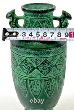 Vintage Japanese bronze vase in archaic style with relief motif, antique Art Deco style