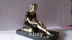 Bronze à patine polychrome (jeune fille au branchage) art déco 1920/25