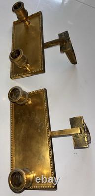 Paire d'appliques art déco en bronze doré a deux lumières