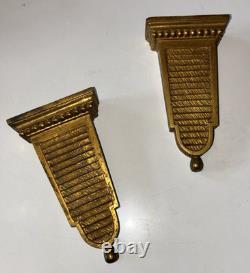 Paire d'appliques art déco en bronze doré a deux lumières