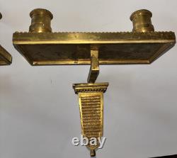Paire d'appliques art déco en bronze doré a deux lumières