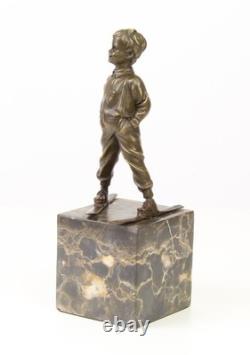 Sculpture en bronze Art déco un garçon avec des skis d'après Ferdinand Preiss