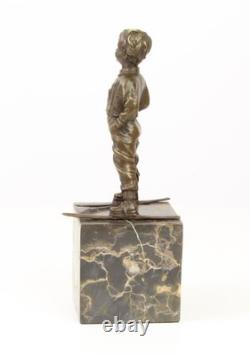 Sculpture en bronze Art déco un garçon avec des skis d'après Ferdinand Preiss